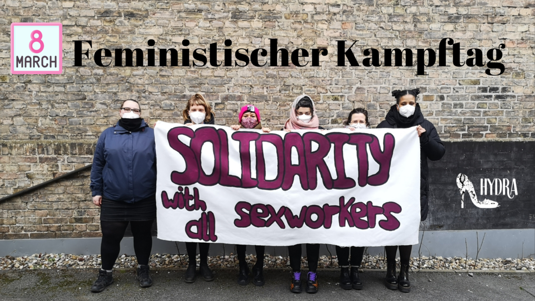 Text "8 March Feministischer Kampftag" 6 Personen halten ein Transparent mit der Aufschrift "Solidarity with all SexWorkers" Hydra-Logo